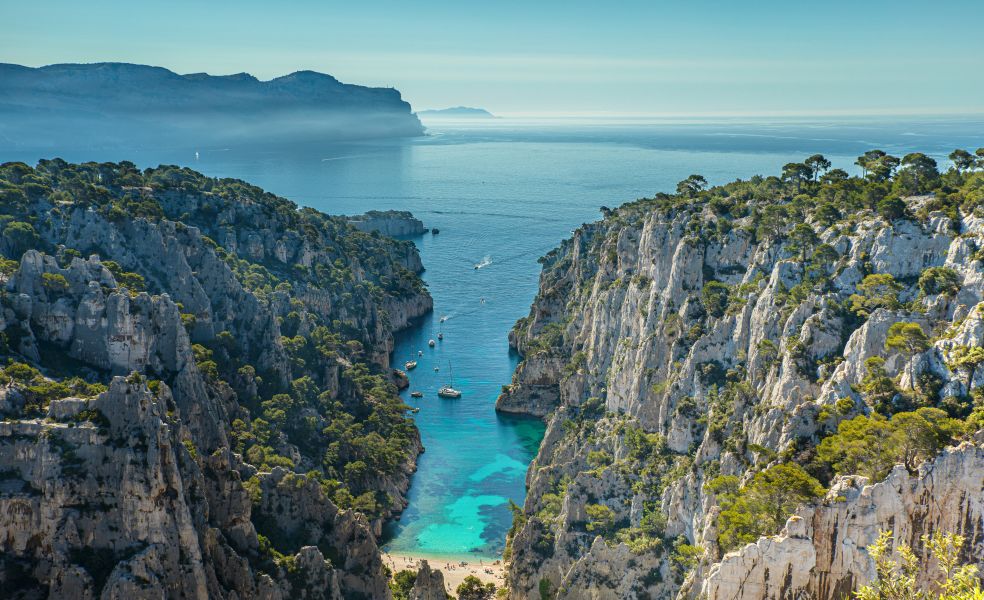 An image of mountains, a beach and the sea located in the Mediterranean 