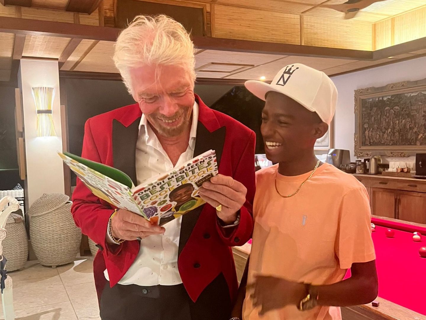 Richard Branson laughing with dyslexic chef, Omari McQueen 