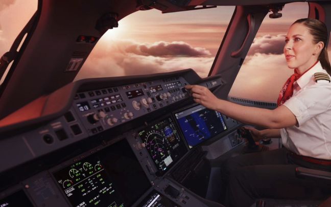 A female Virgin Atlantic pilot in the flight deck of an aircraft