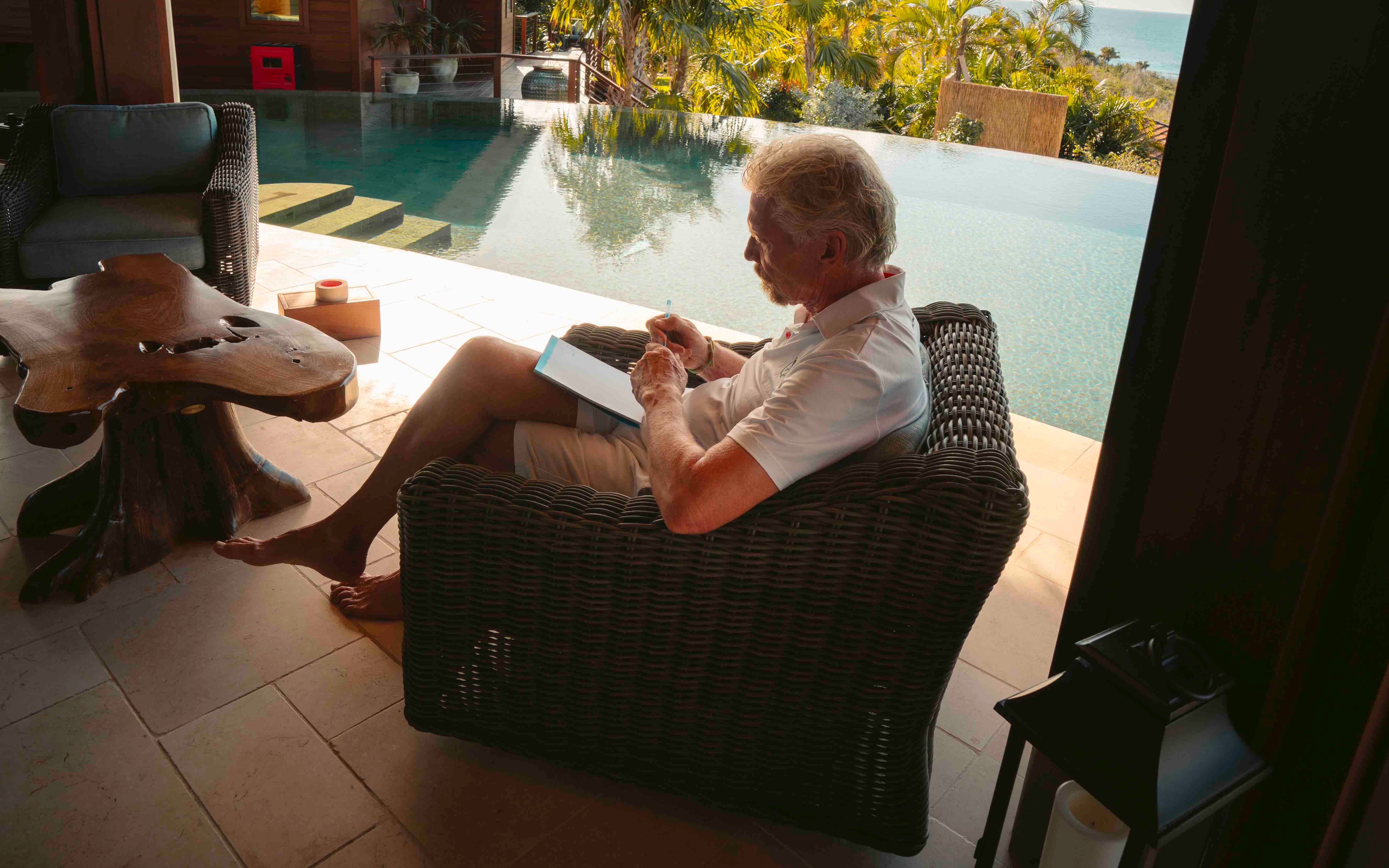 Richard Branson reading on Necker Island