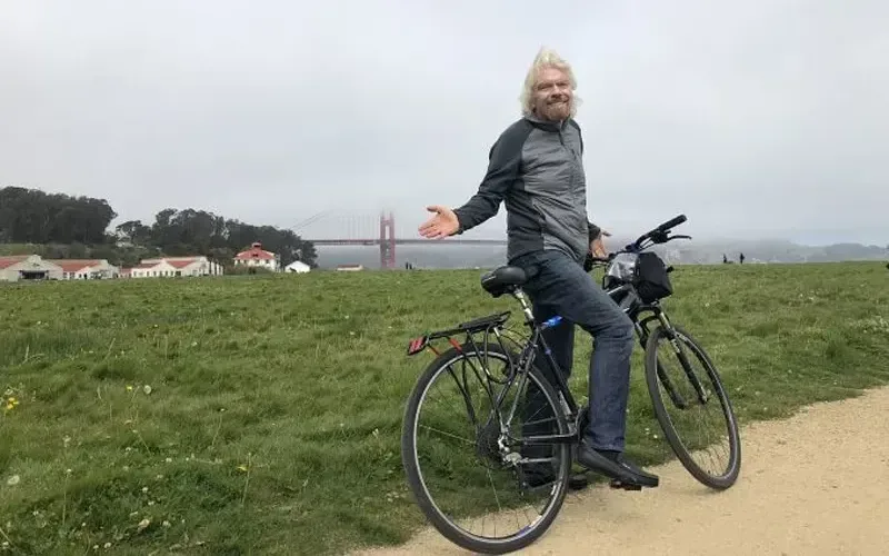 Richard Branson cycling around San Francisco 
