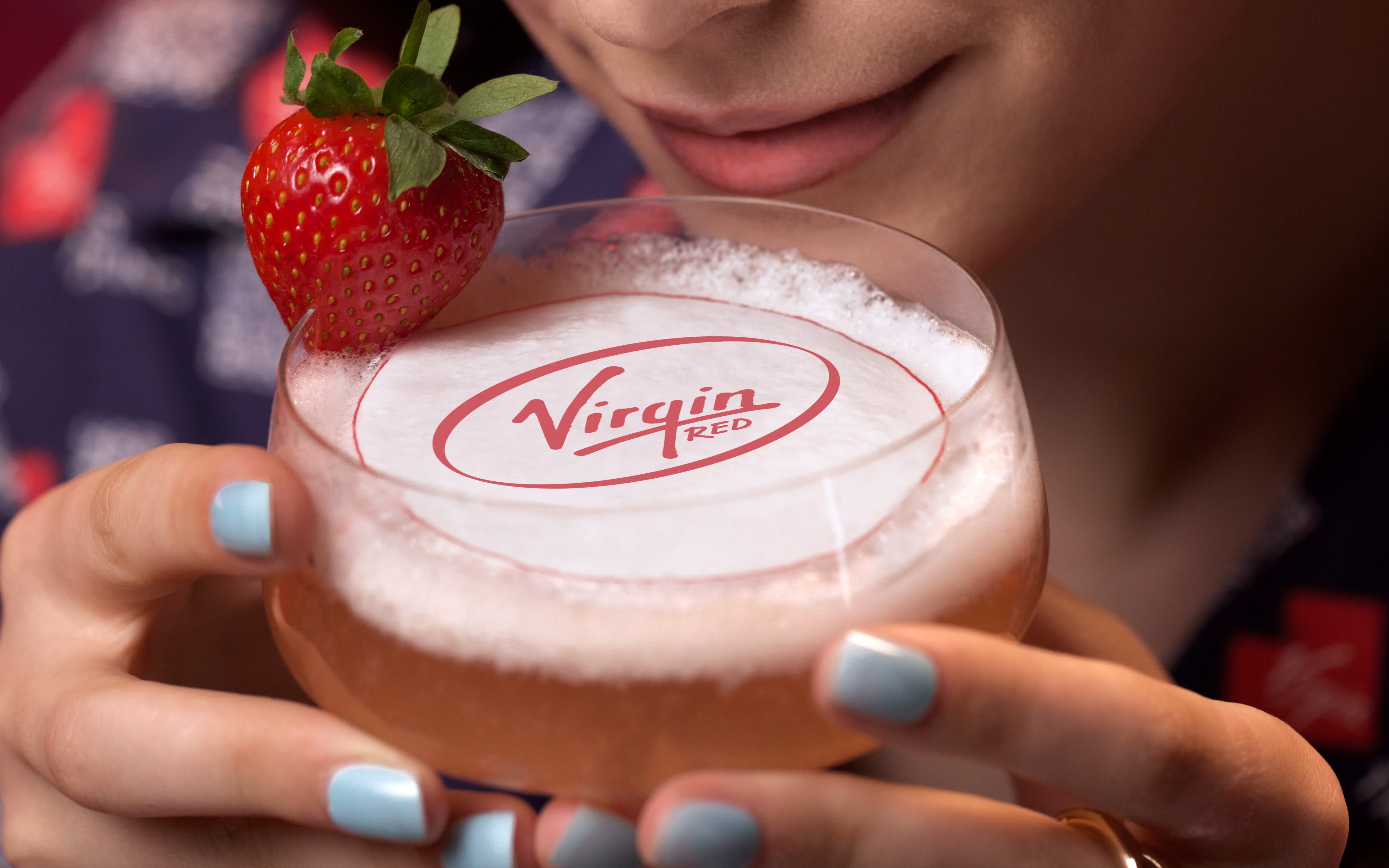 Woman enjoys a Virgin Red cocktail