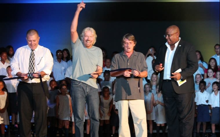 Richard Branson cutting a ribbon