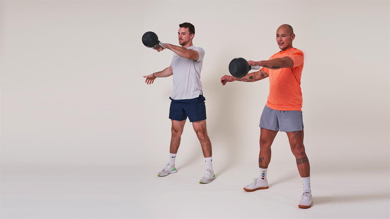 Two men doing arm swings with weights