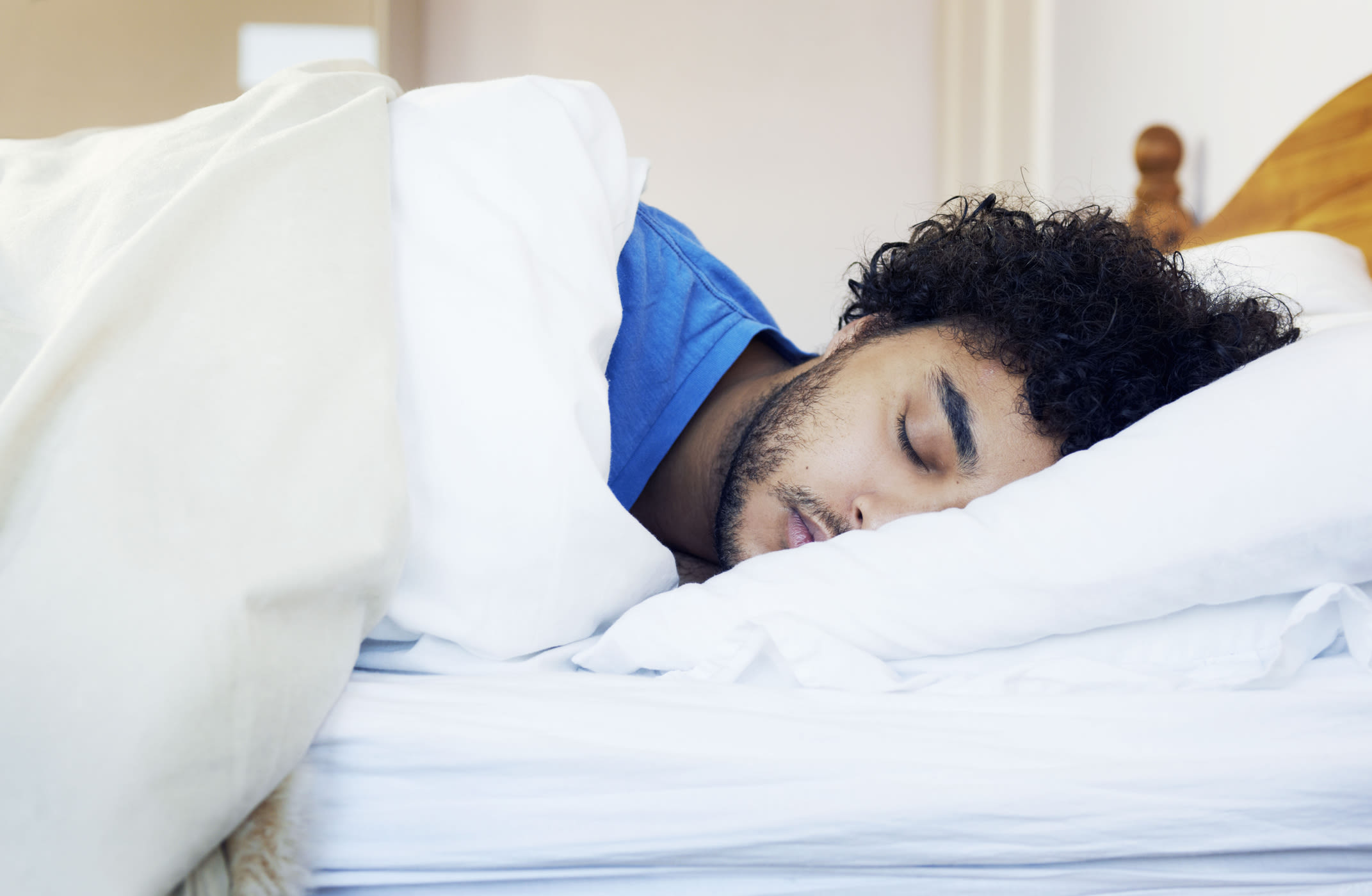 A man asleep in bed