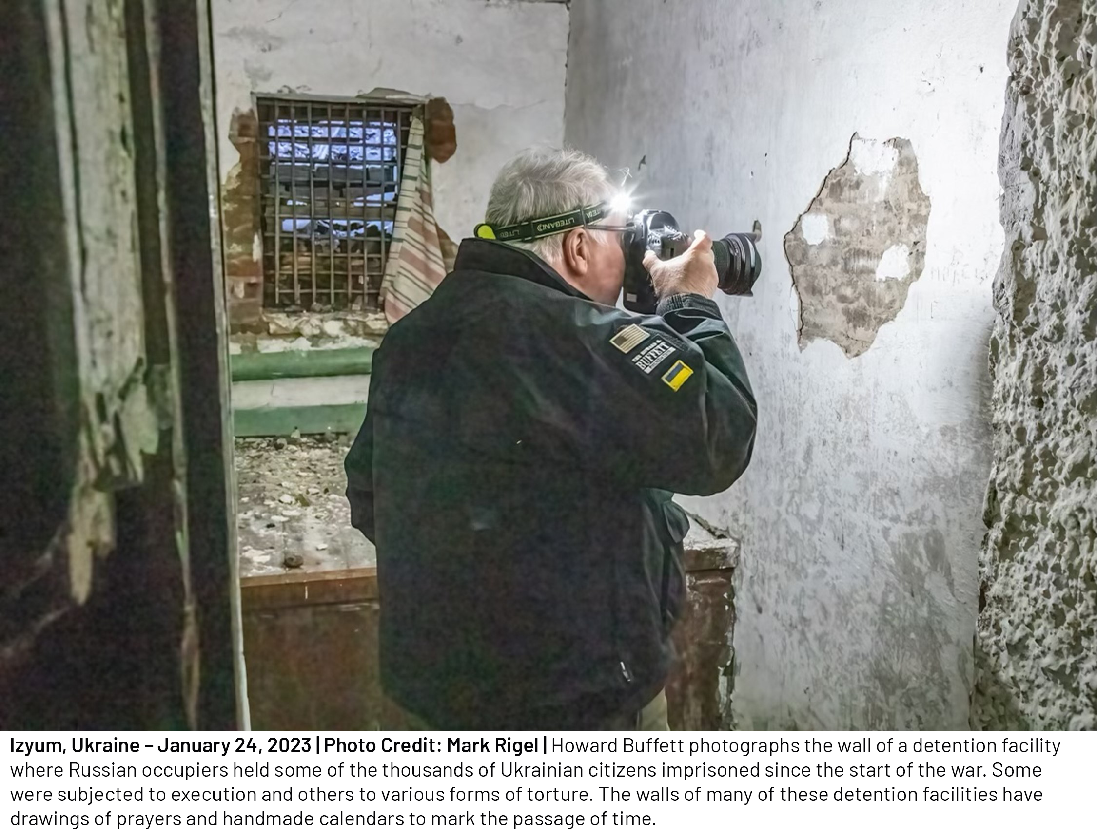 Howard Buffett photographs the wall of a detention facility where Russian occupiers held some of the thousands of Ukrainian citizens imprisoned since the start of the war. Some were subjected to execution and others to various forms of torture. 