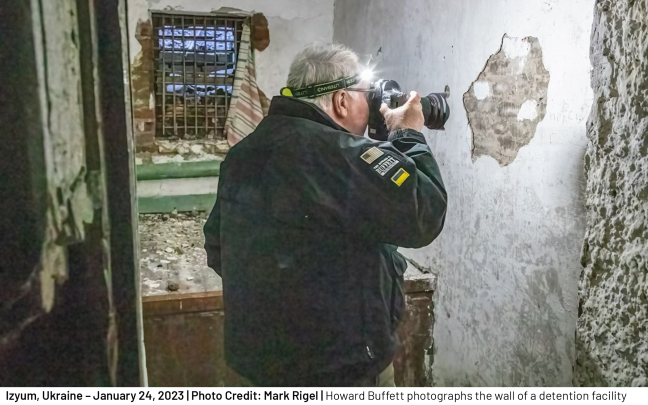 Howard Buffett photographs the wall of a detention facility where Russian occupiers held some of the thousands of Ukrainian citizens imprisoned since the start of the war. Some were subjected to execution and others to various forms of torture. 