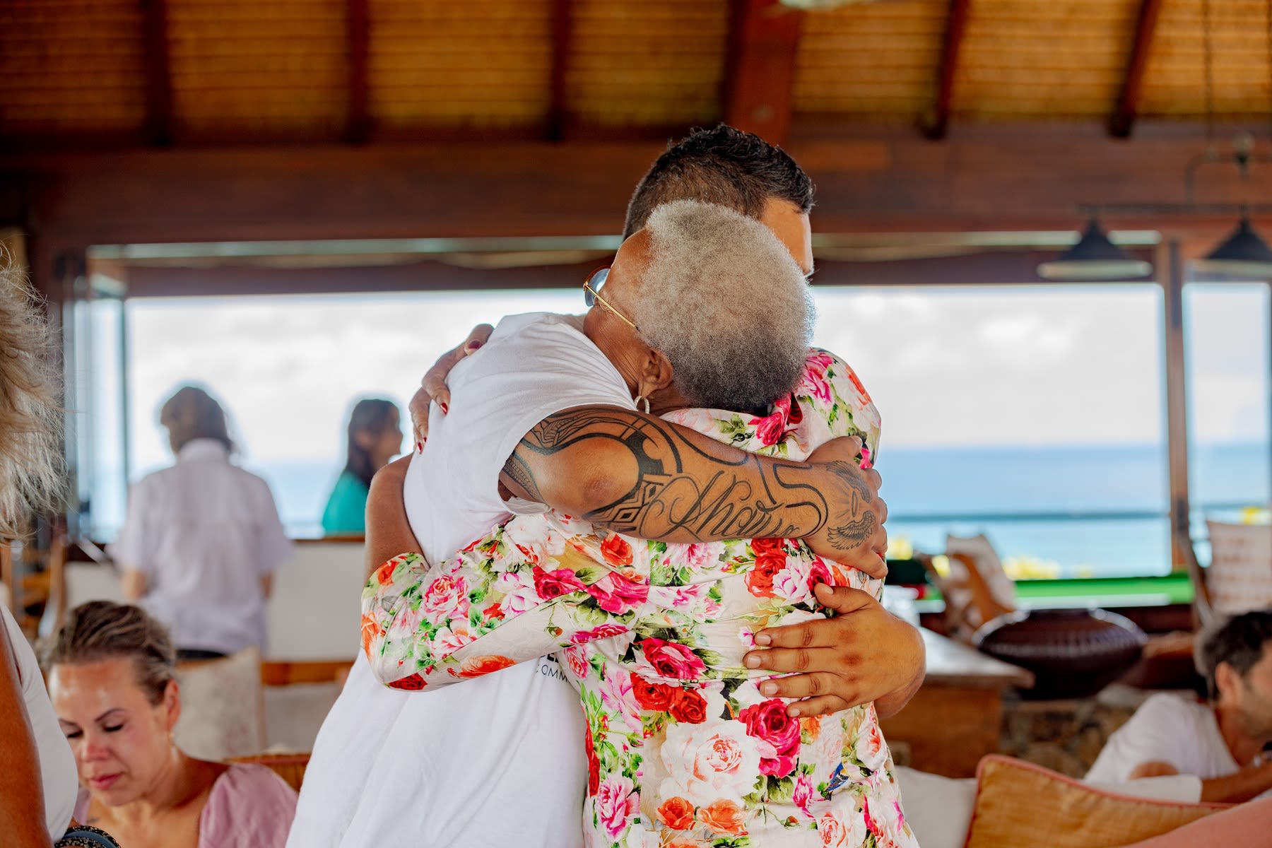 Keenan Mundine hugging at a Virgin Unite Necker Gathering