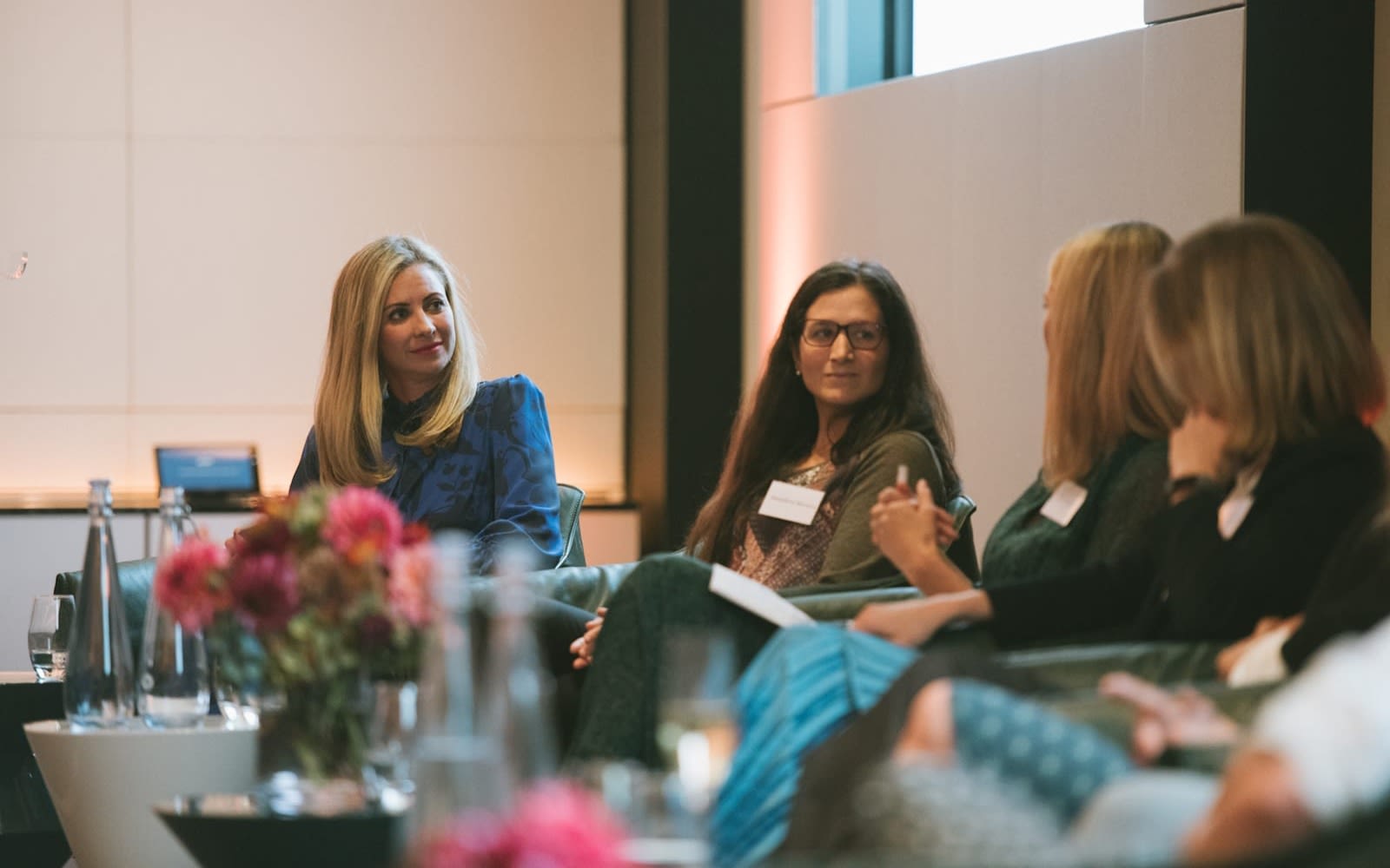 Holly Branson on panel listening to three other women