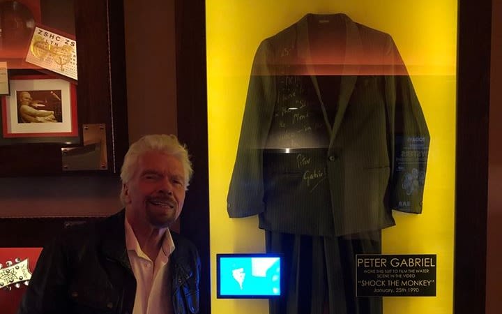 Richard Branson posing with Peter Gabriel's suit at the Hard Rock Hotel in Las Vegas, which will become Virgin Hotels Las Vegas