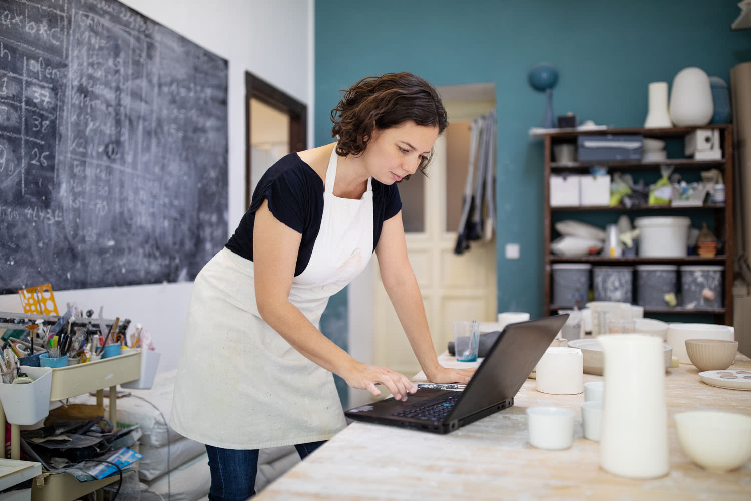 A woman running her business from her laptop.