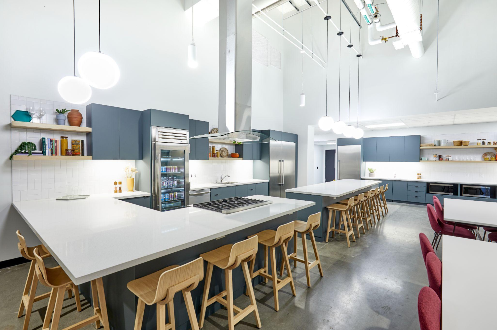 A kitchen area with bar stools