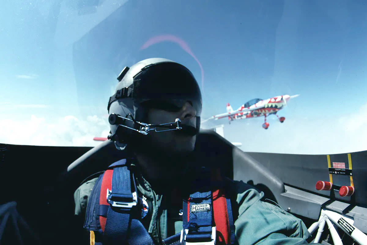 Image of a pilot in a cockpit during a flying lesson