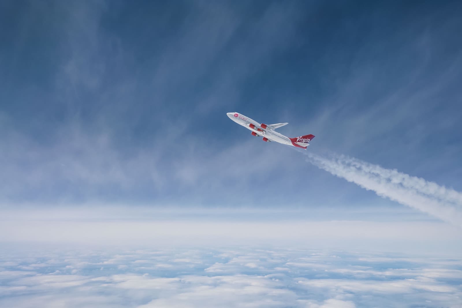 Virgin Orbit's adapted Boeing 747 Cosmic Girl taking off through the skies