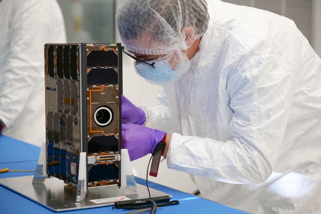 The Royal Netherland Air Force’s BRIK-II satellite undergoes a final inspection prior to integration.