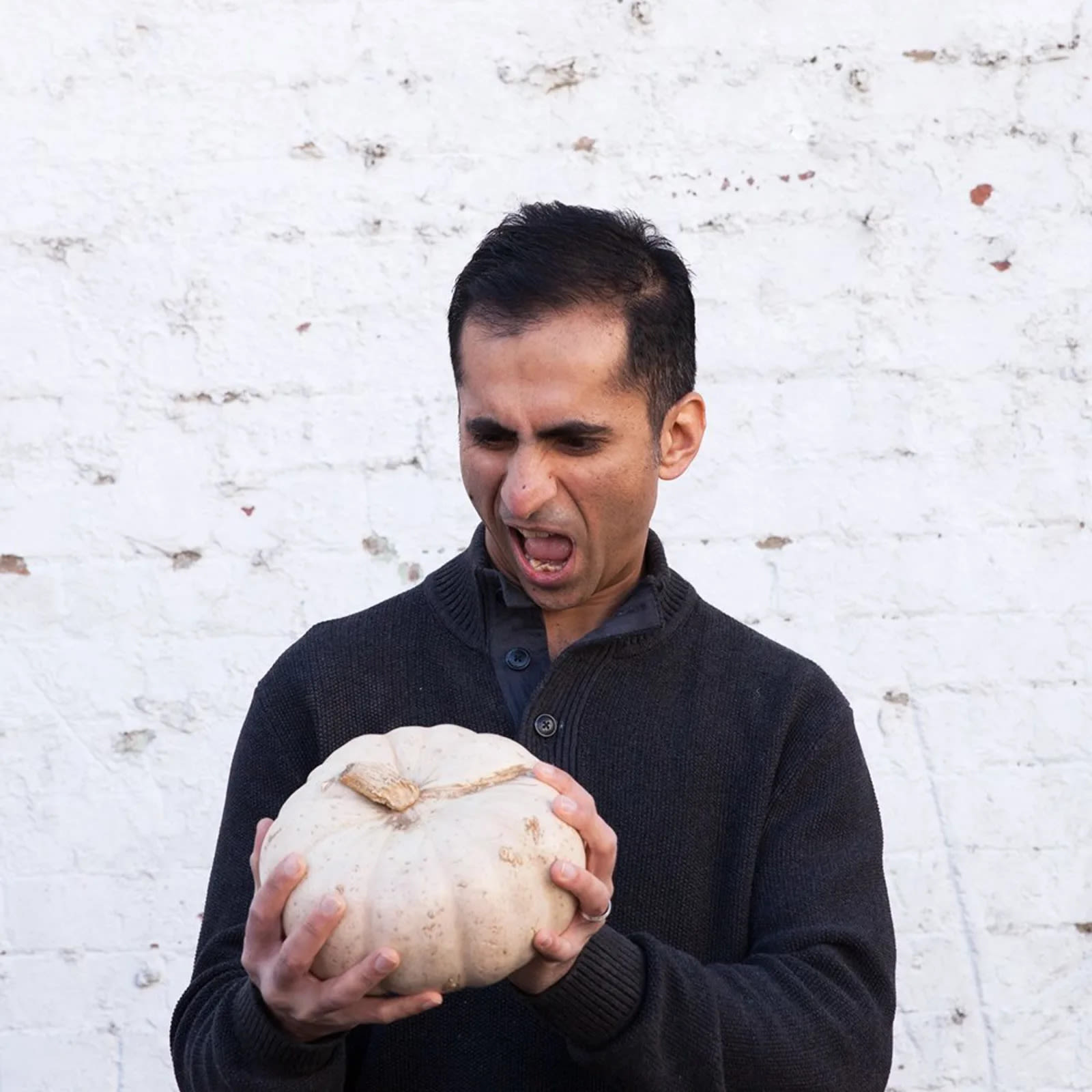 The founder of ODDBOX poses with a pumpkin