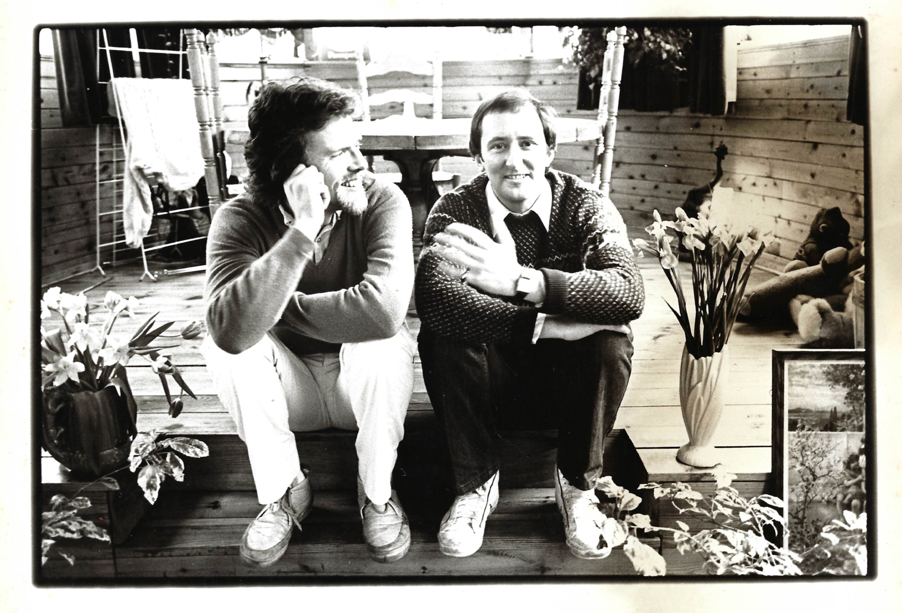 Richard Branson sitting with Al Clark on his old houseboat