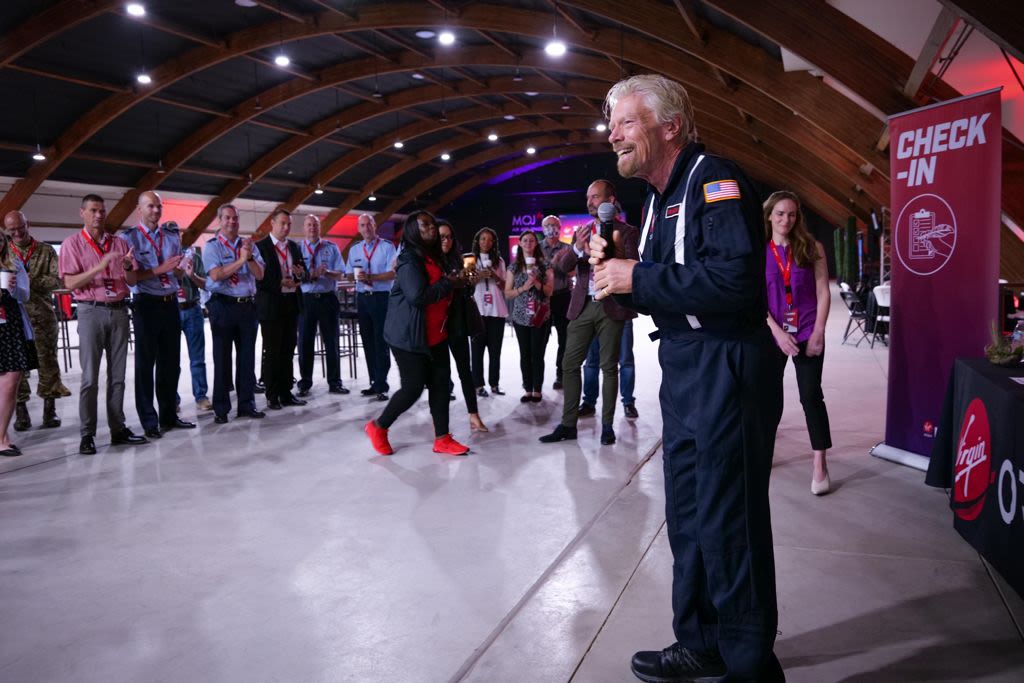Richard Branson smiling with the Virgin Orbit team during the Tubular Bells: Part One space mission