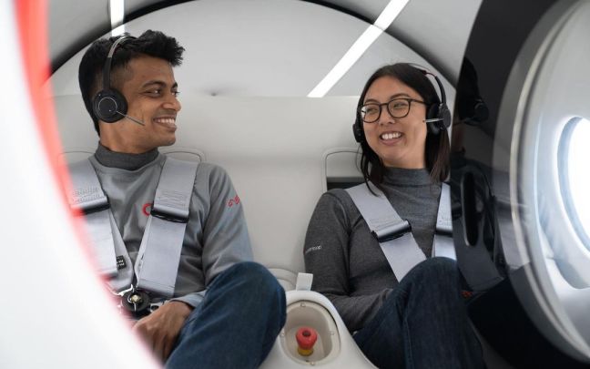 Tanay and Anne sit in the Virgin Hyperloop XP-2 pod