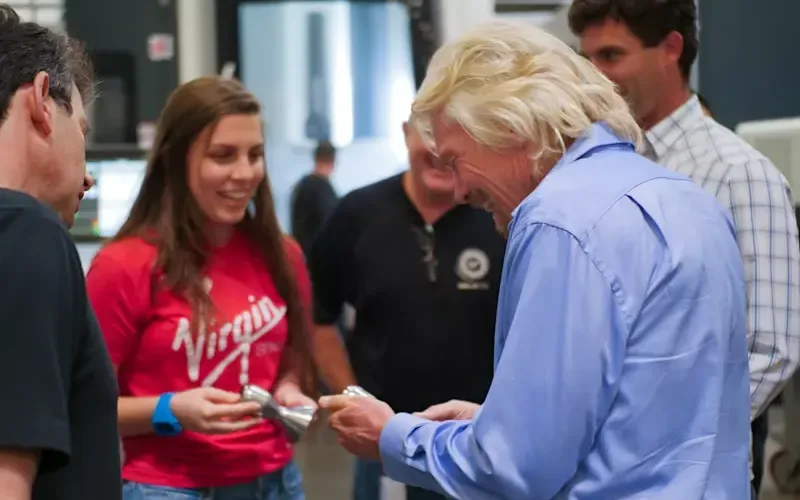 Richard Branson talking to members of the Virgin Orbit team