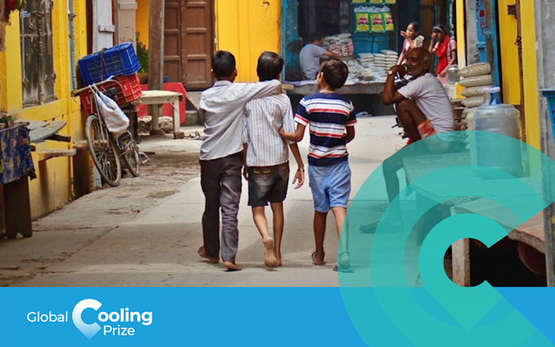 Three children walking together down a colourful alley