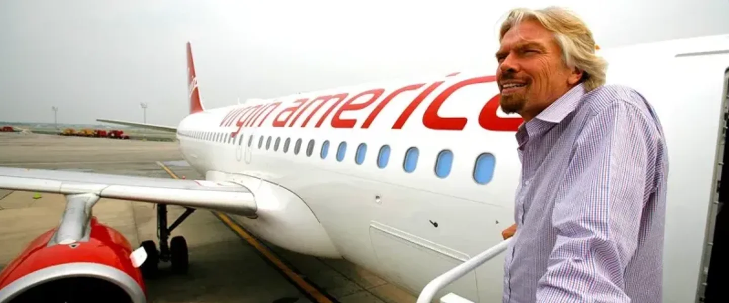 Richard Branson boards a Virgin America plane in 2016