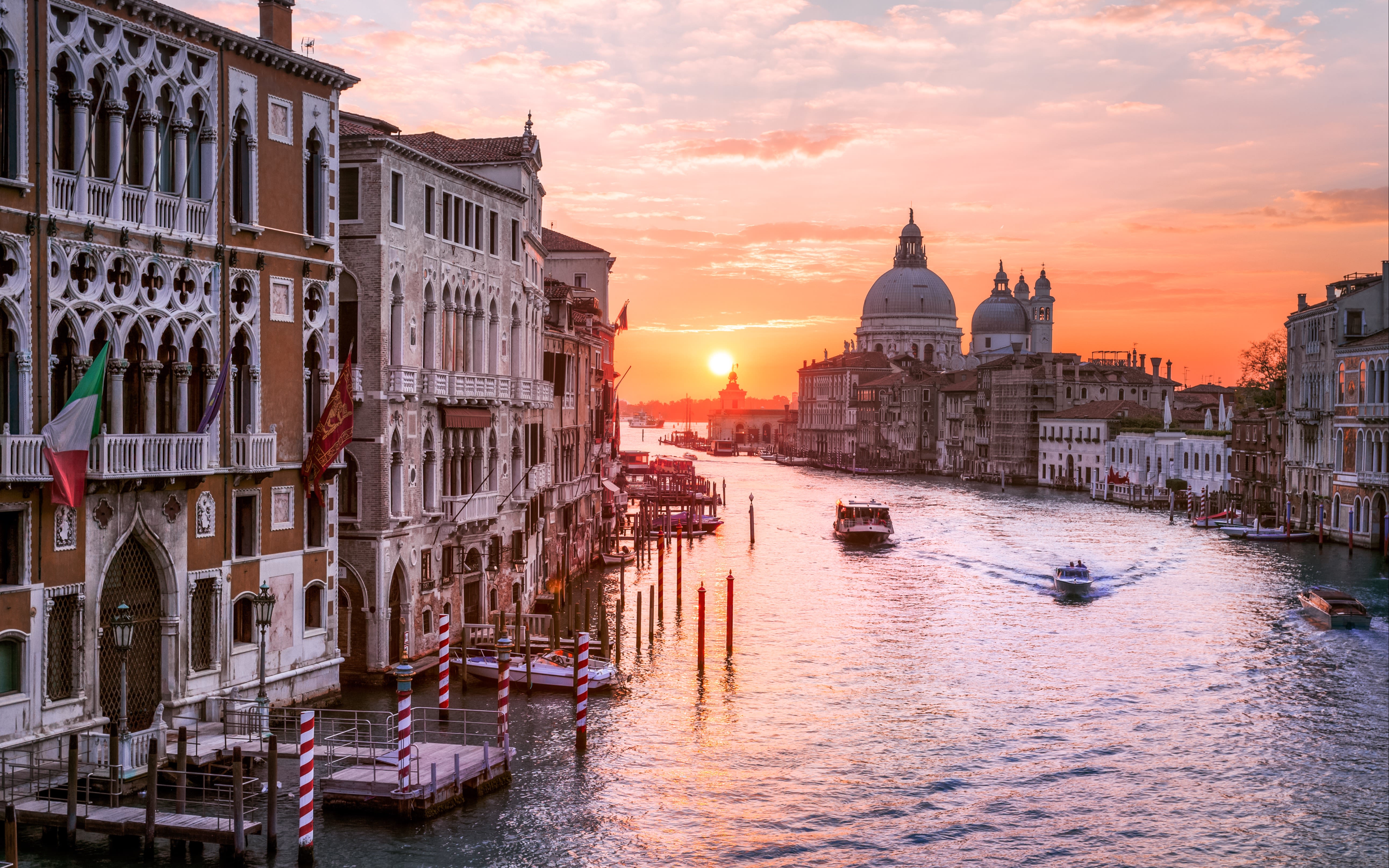 Image of a canal in Venice at sunset. 
