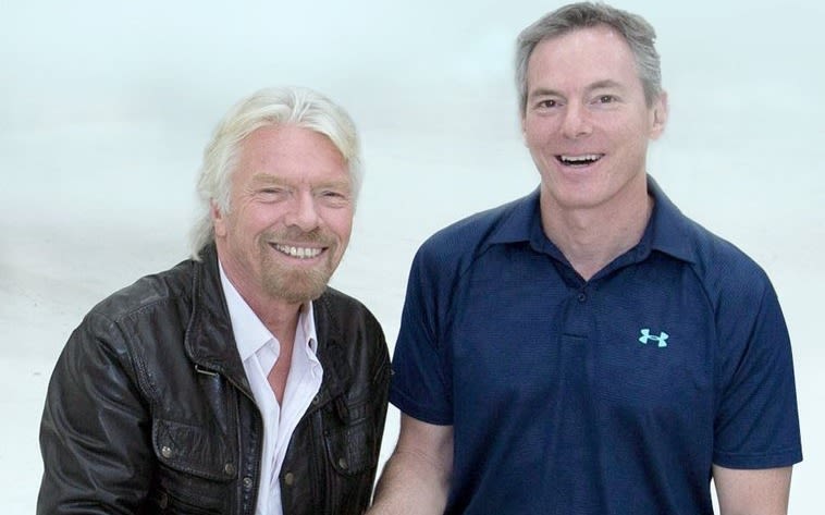 Richard Branson shakes hands with Qualcomm Chairman Dr Paul Jacobs