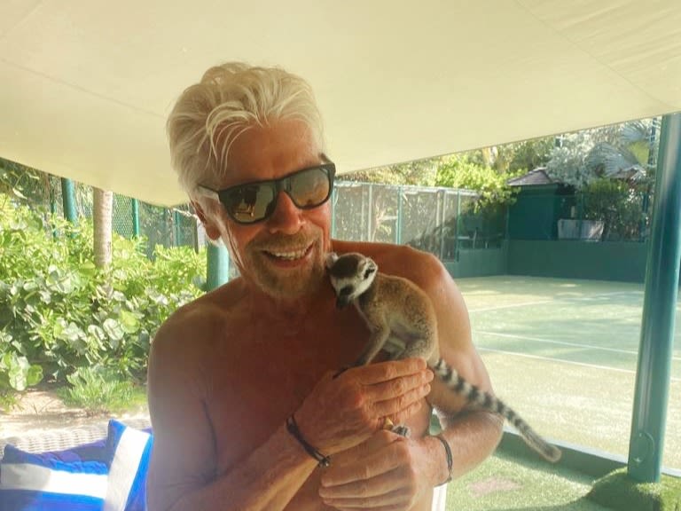 Richard Branson on Necker Island with Pluto the Lemur