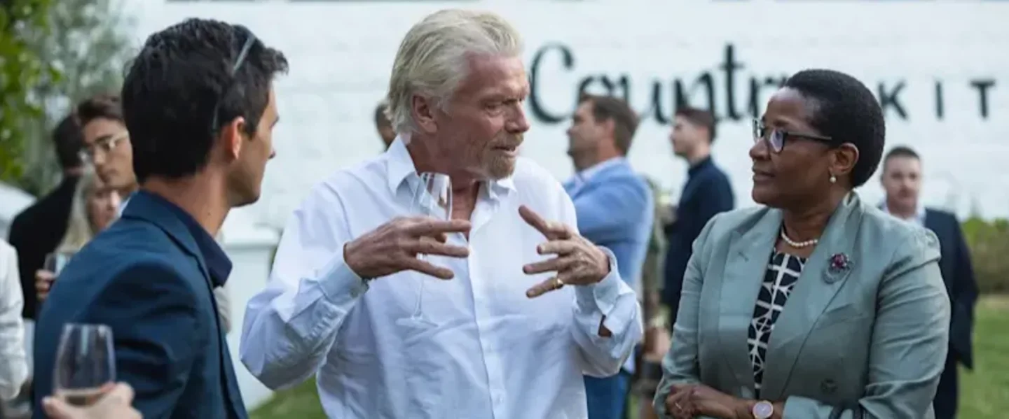 Richard Branson in conversation with people in South Africa
