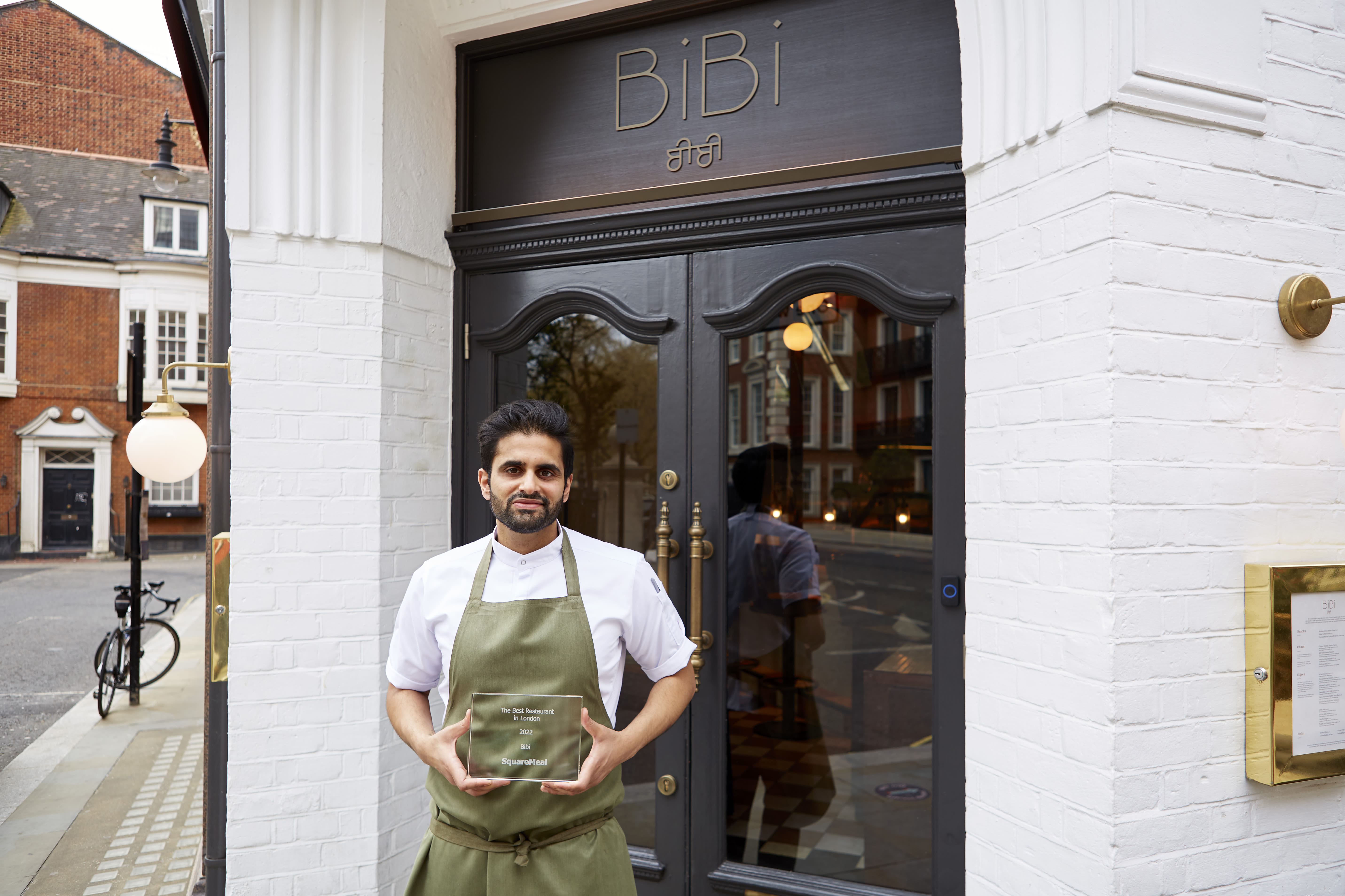 Image of BiBi chef, Chet Sharma, standing outside the BiBi restaurant in London.