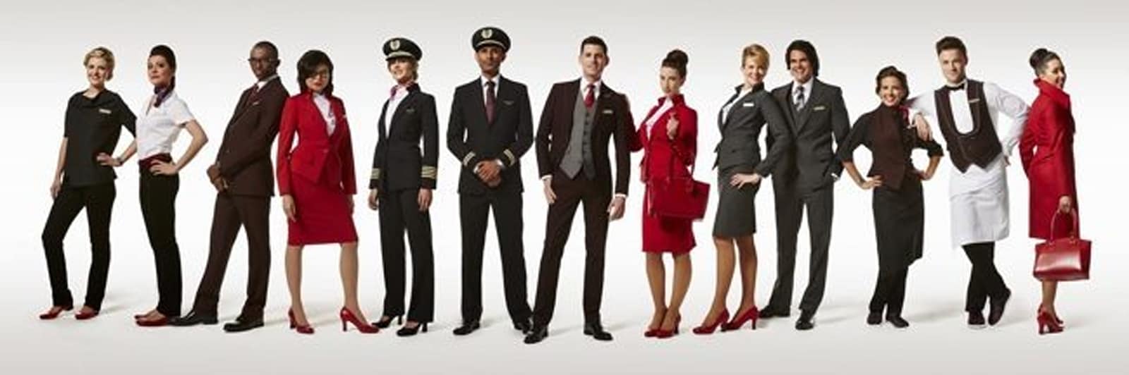 13 Virgin Atlantic employees showing the Virgin Atlantic uniform designed by Vivienne Westwood