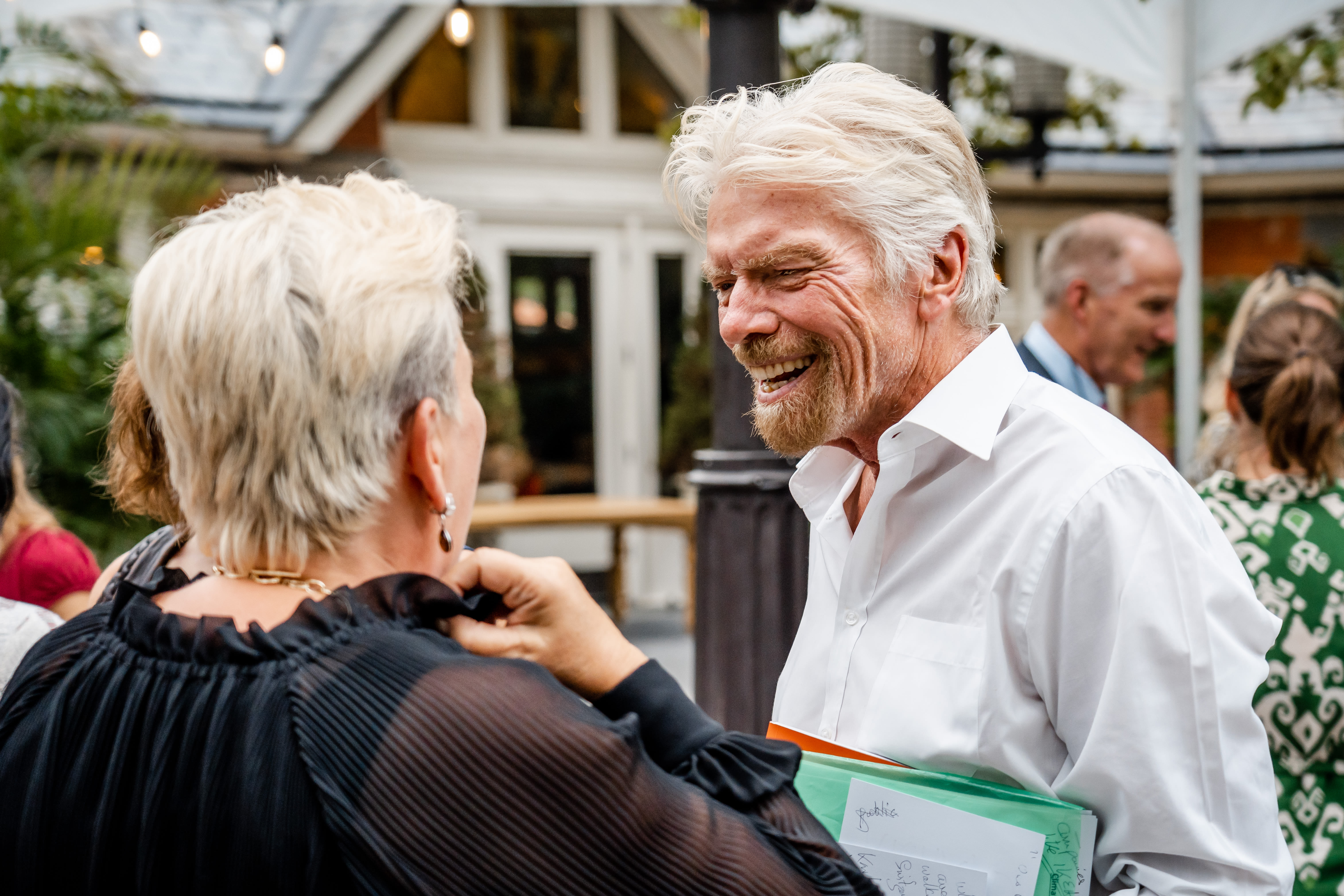 Richard Branson and Halla Tomasdottir talking together in New York