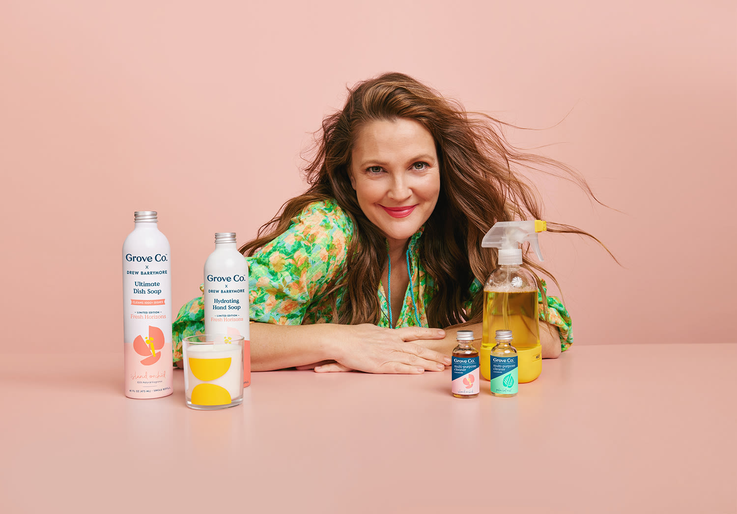 Drew Barrymore posing with her Grove Co. collection products
