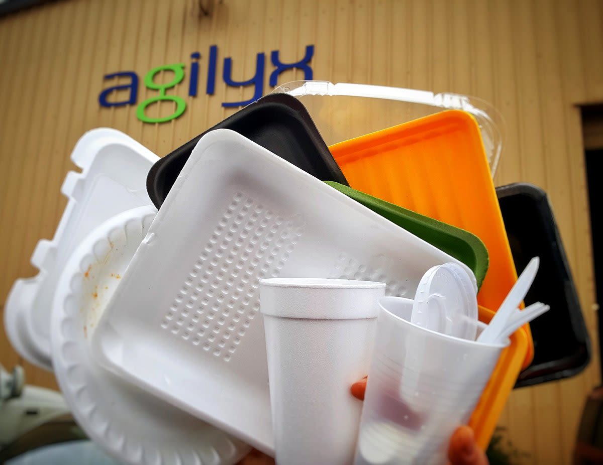 Plastic rubbish pictured in front of an agilyx sign