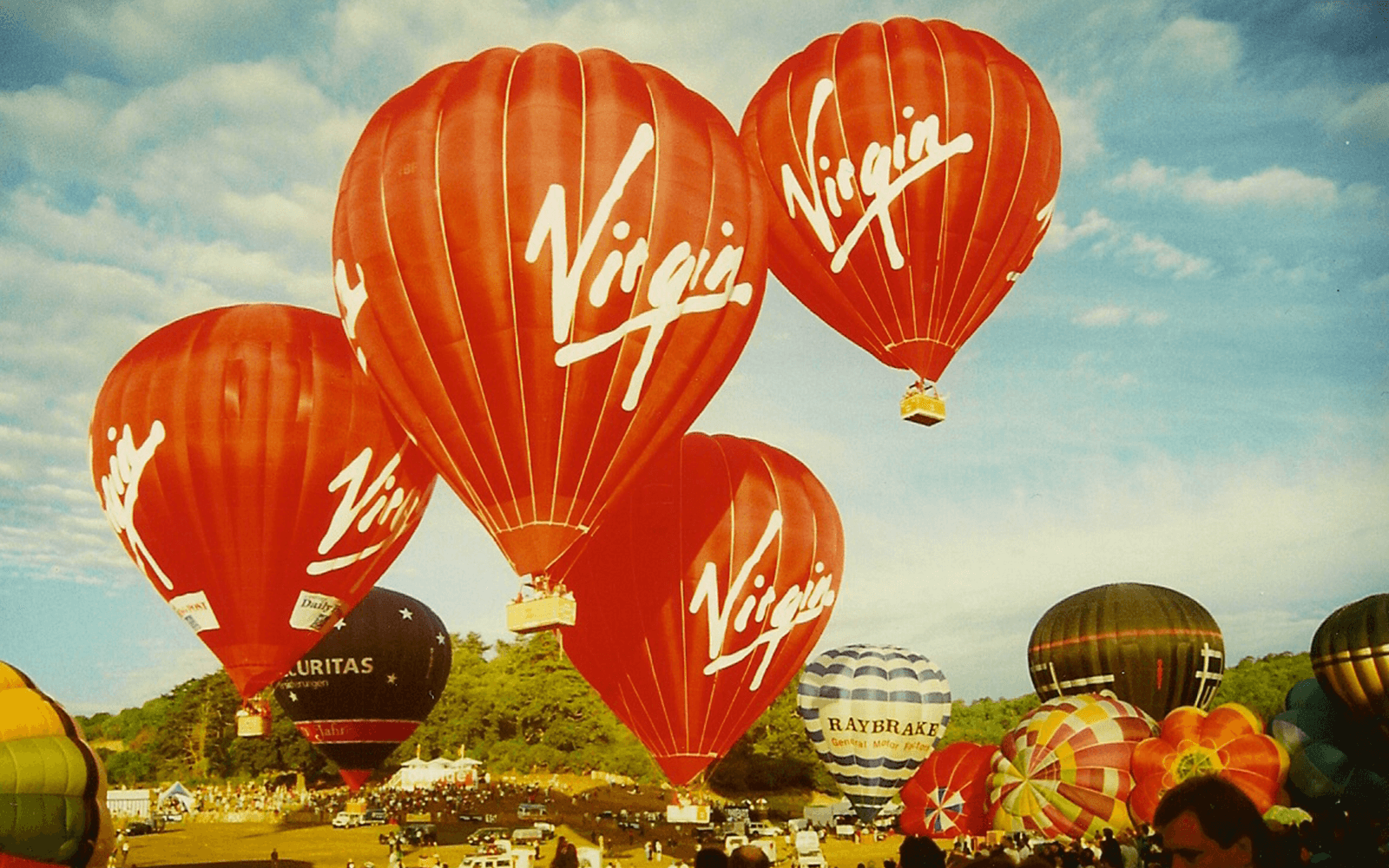 A historic image of four Virgin Balloon Flights taking to the air