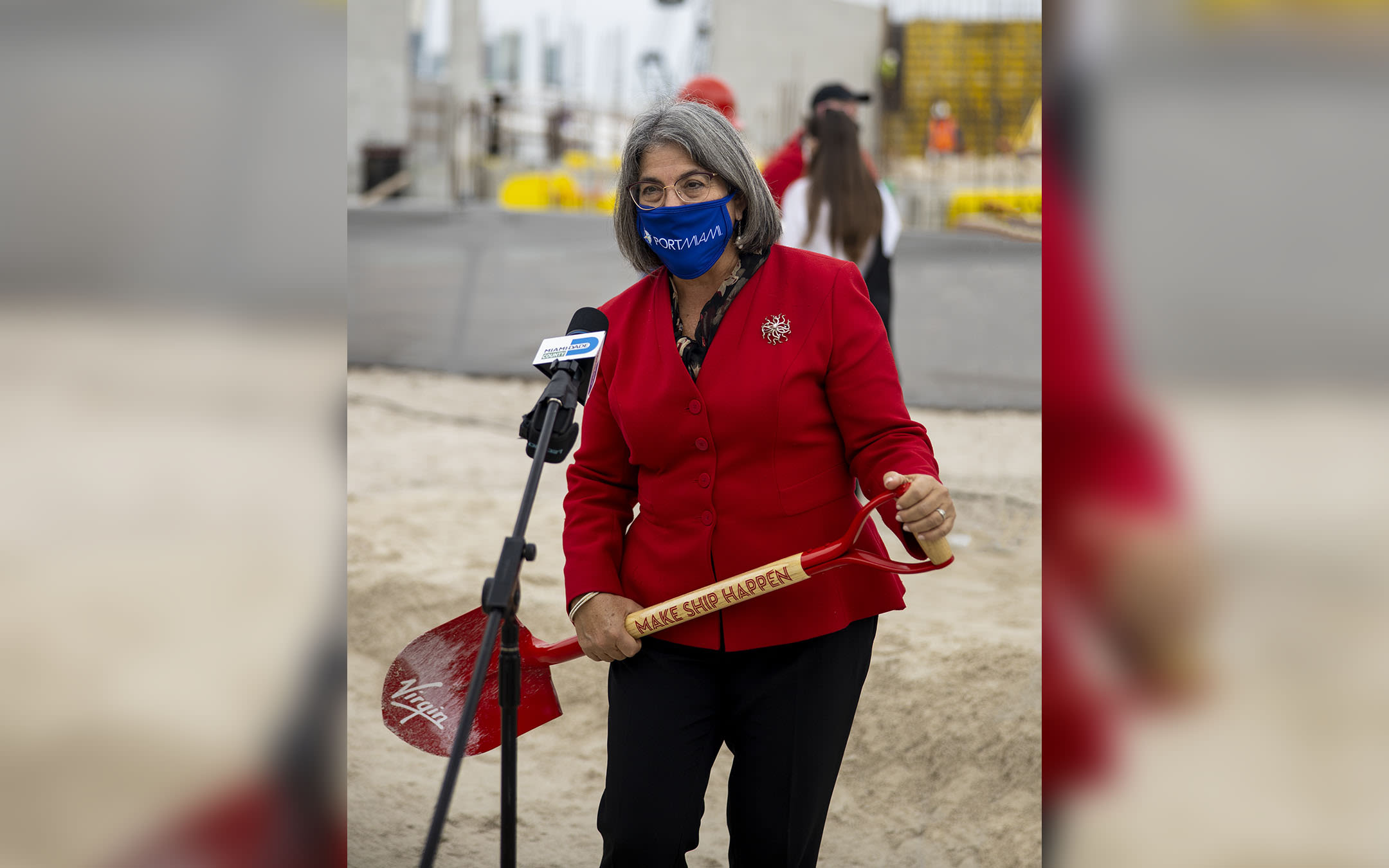 Miami-Dade Mayor Daniella Levine Cava at the breaking ground ceremony at PortMiami, holding a Virgin Voyages shovel