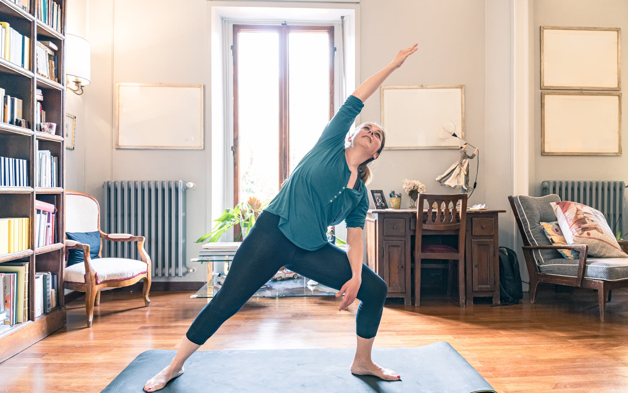 A woman doing yoga at home