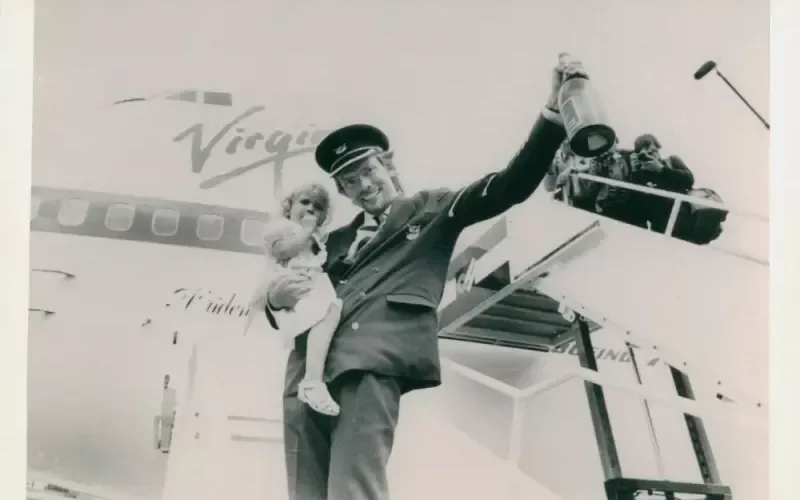 Richard Branson and Holly Branson celebrate the inaugural Virgin Atlantic flight in 1984