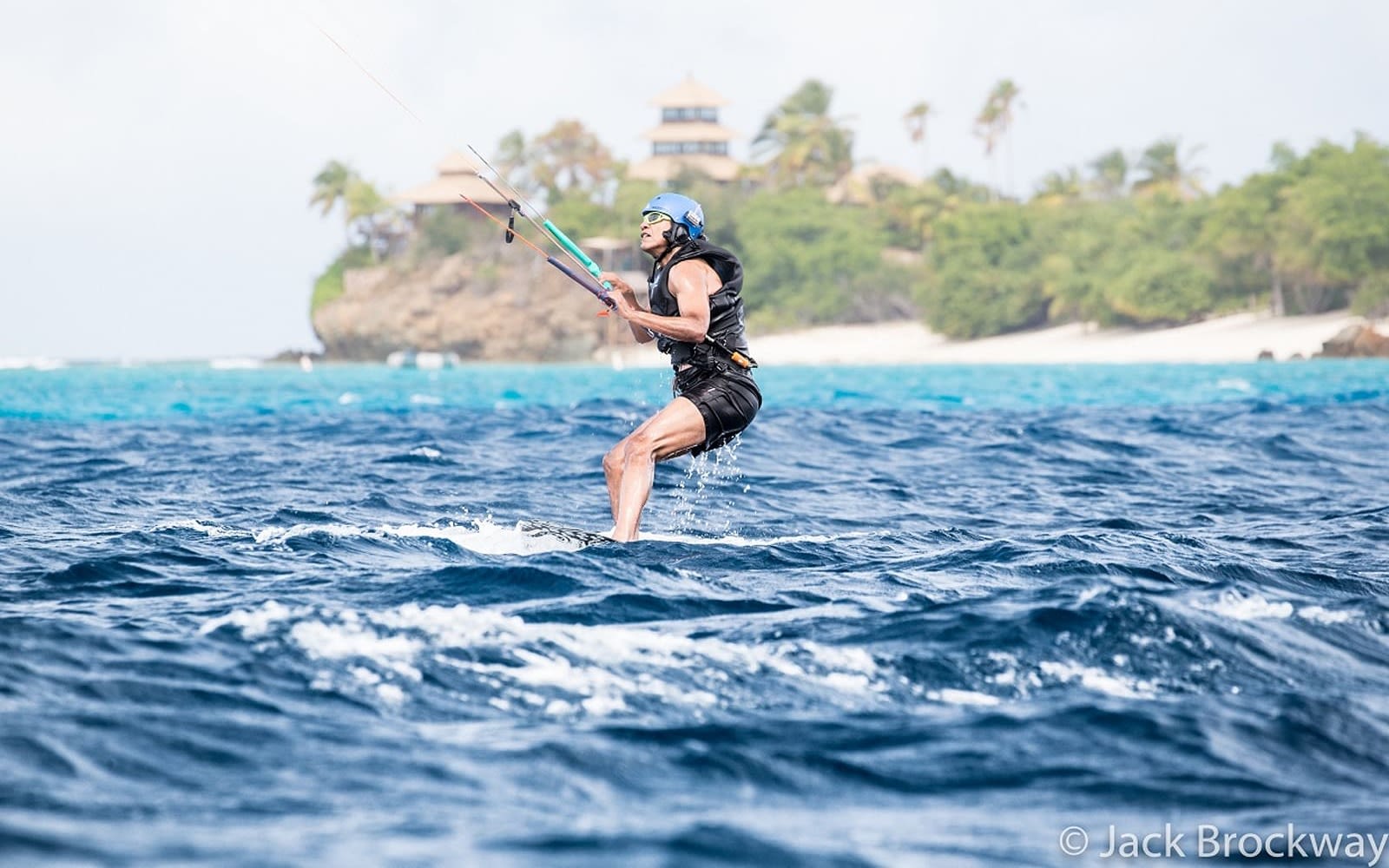 Barack Obama kitesurfing with Necker Island in the background