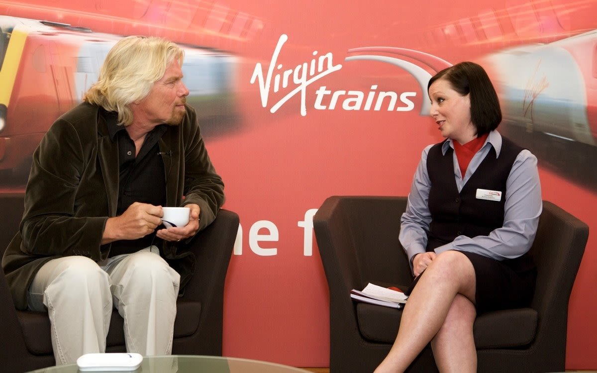 Richard Branson having a cup of tea at a Virgin Trains event in 2015