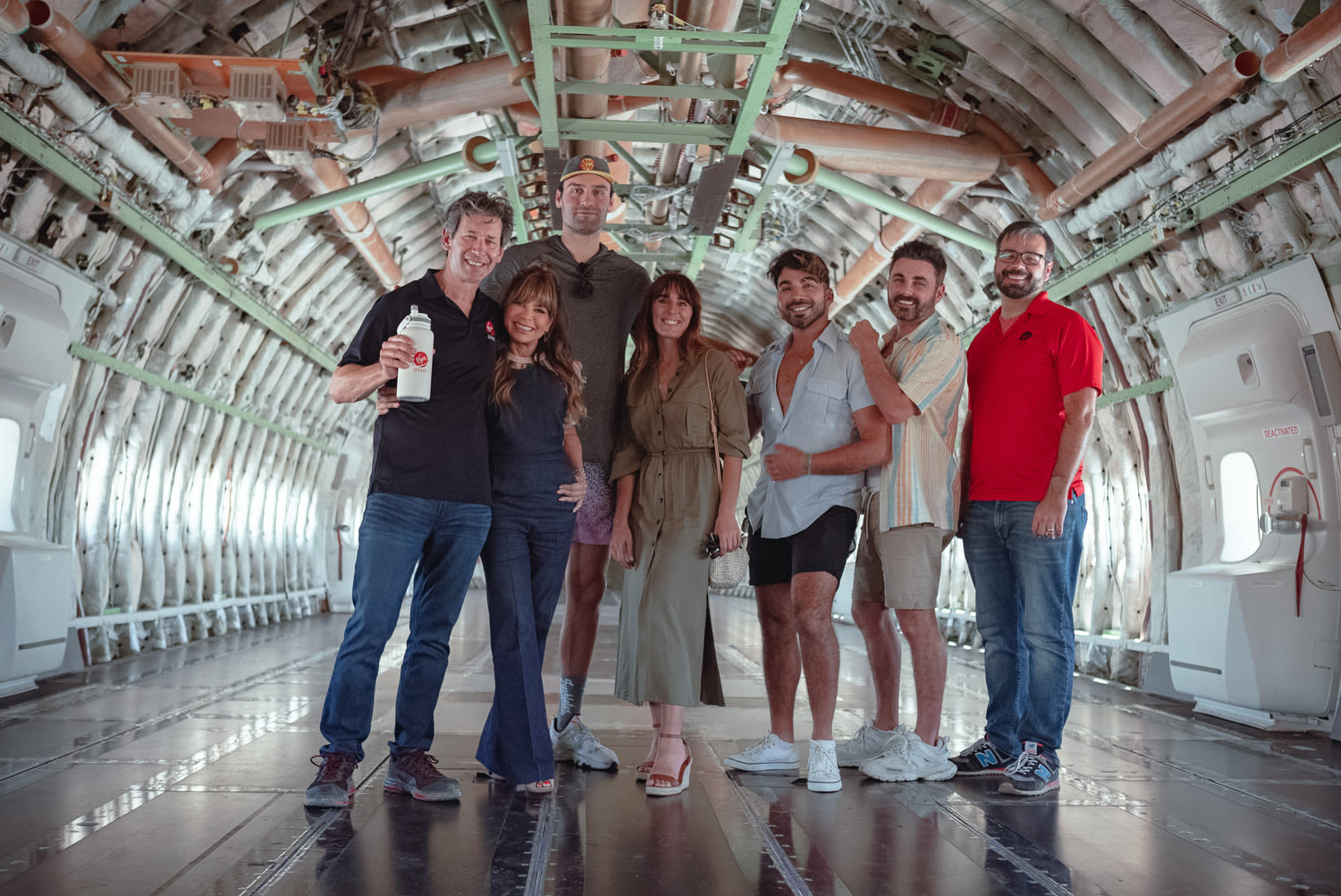 Paula Abdul with Dan Hart and other Virgin Orbit team members inside Cosmic Girl