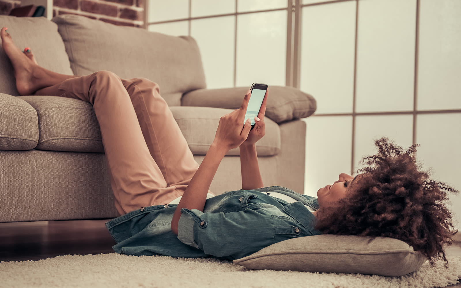 A woman reading her phone