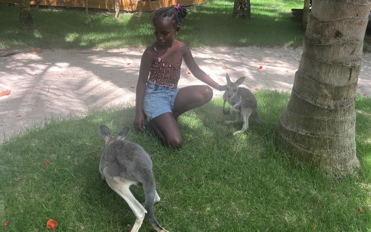 Jamie plays with the kangaroos 