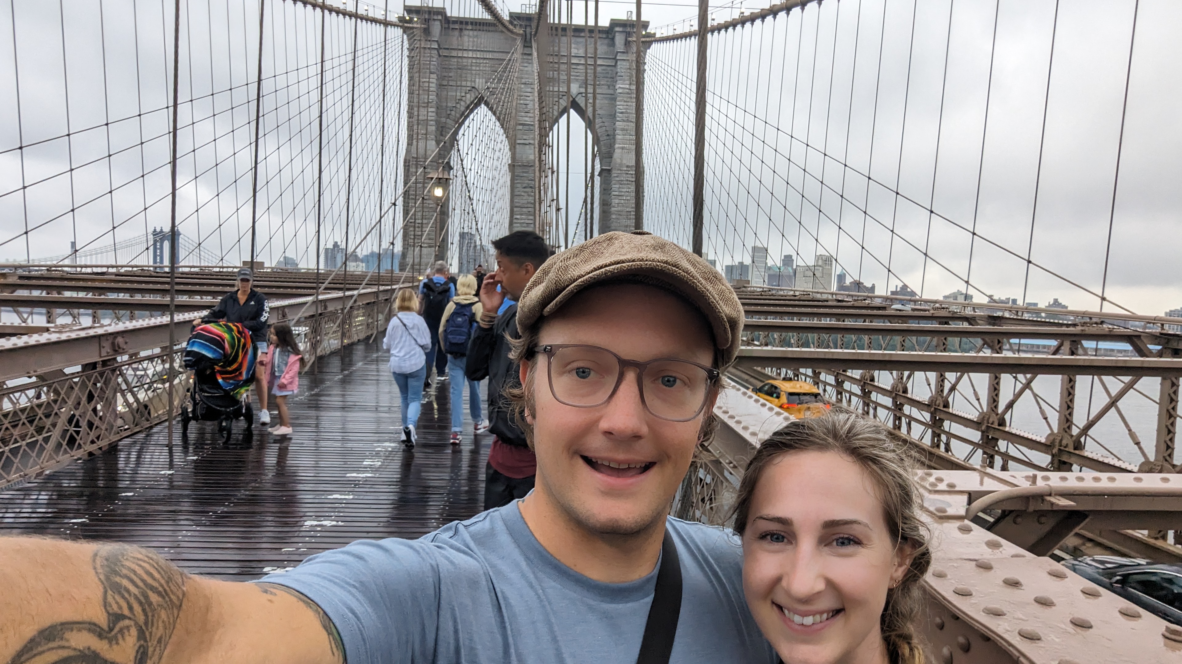 A picture of eric and his wife on the brooklyn bridge.