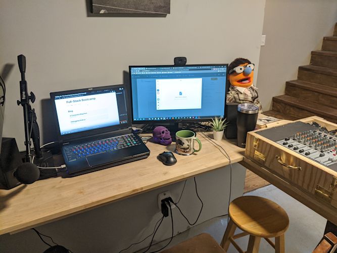 picture of a desk with a laptop and monitor