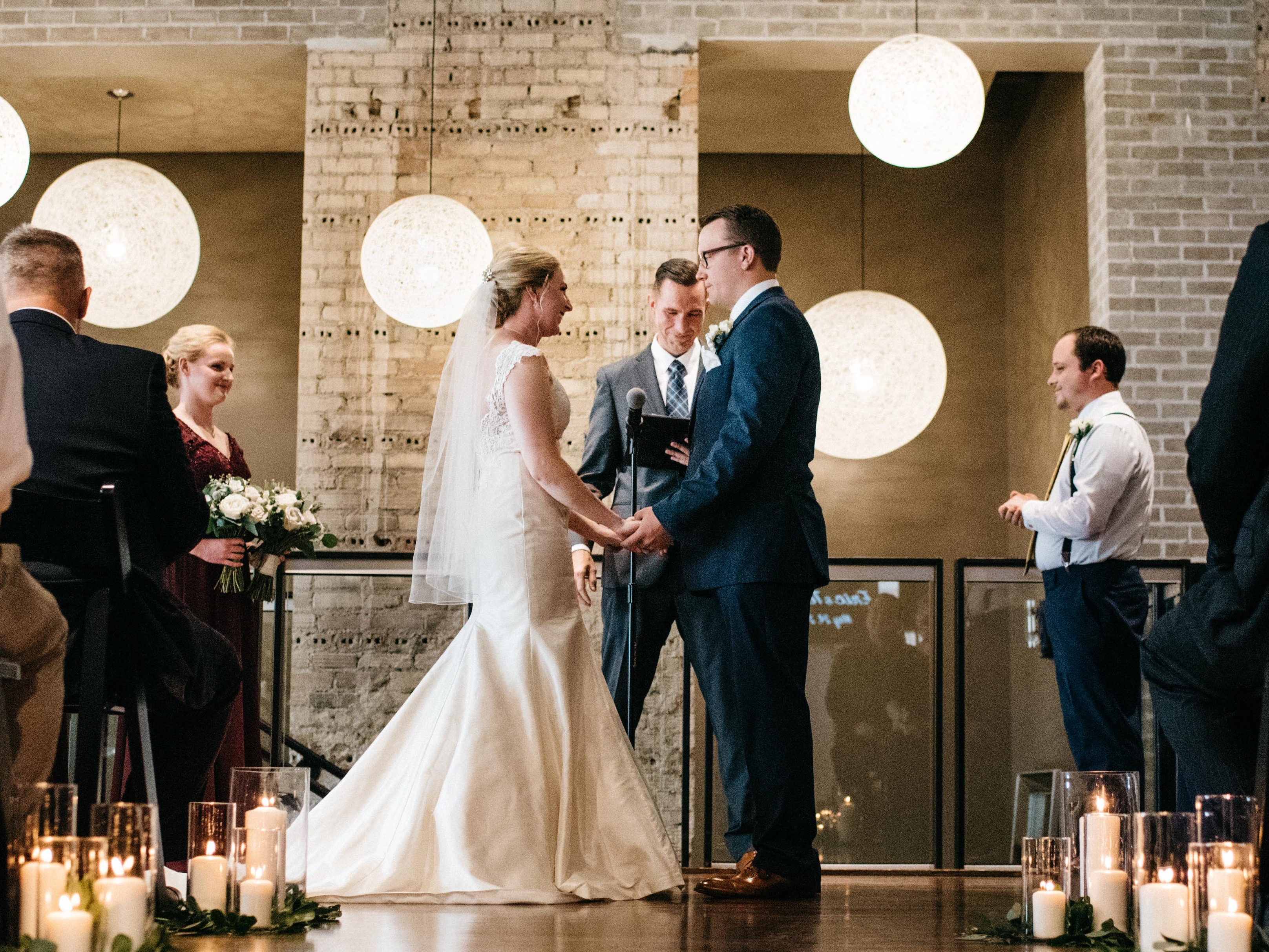  a long engagement (because it was hard to plan during the first years of grad school), we finally got married and had an excellent ceremony. My long-time friend, Tony, performed the nuptials. Here we are at the altar saying "I do". There was an A/C vent right above me, which is why it might look like I have tears in my eyes.