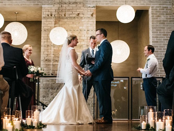 a long engagement (because it was hard to plan during the first years of grad school), we finally got married and had an excellent ceremony. My long-time friend, Tony, performed the nuptials. Here we are at the altar saying "I do". There was an A/C vent right above me, which is why it might look like I have tears in my eyes.