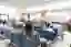 Blur image of a crowded hospital lobby.