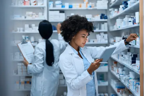 pharmacist looking at list
